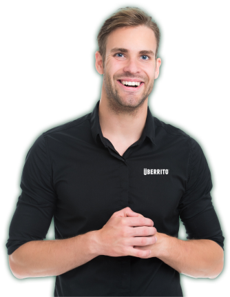 An Uberrito Mexican Franchise staff smiling in a black shirt
